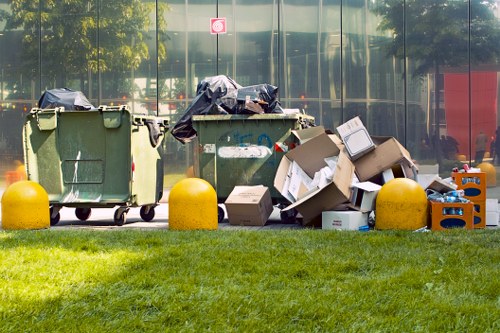Team members performing garden clearance tasks